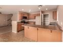 Well-equipped kitchen with tile floors, ample counter space, and modern appliances at 1585 E Jeanne Ln, San Tan Valley, AZ 85140