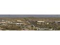 Expansive view of the neighborhood landscape, featuring a variety of desert homes against a mountainous backdrop at 25572 N 113Th Way, Scottsdale, AZ 85255