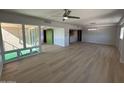 Bright living room featuring wood floors, ample natural light, and an open layout at 349 E Thomas Rd # E301, Phoenix, AZ 85012