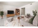 Serene living room featuring a modern design, ample space, and abundant natural light at 3802 E Shaw Butte Dr, Phoenix, AZ 85028