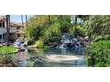Enjoy this outdoor water feature with waterfalls and lush landscaping at 517 S Marina Dr, Gilbert, AZ 85233