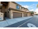 Side view of townhouses with attached garages and desert landscaping at 705 W Queen Creek Rd # 1220, Chandler, AZ 85248