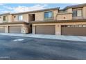 Street view of a modern townhouse complex featuring private garages at 705 W Queen Creek Rd # 1220, Chandler, AZ 85248