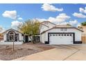 Charming home with a well-manicured yard and an attached two-car garage, perfect for suburban living at 807 E Harvard Ave, Gilbert, AZ 85234