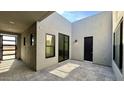 Private courtyard featuring a modern design, stucco walls, and a tiled ground at 13278 E Buckskin Trl, Scottsdale, AZ 85255