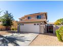 Two story home with a two car garage, desert landscaping, tile roof and fenced in side yard at 14970 N 172Nd Dr, Surprise, AZ 85388