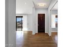 Bright entryway with wood floors and a decorative front door at 16210 E Links Dr, Fountain Hills, AZ 85268