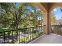 Balcony view overlooking a tree lined street and green space at 21141 W Main St, Buckeye, AZ 85396