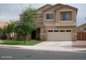 Attractive two-story home featuring a two-car garage, manicured lawn, and well-maintained landscaping at 4253 E Colonial Dr, Chandler, AZ 85249