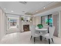 Elegant dining area with a decorative fireplace and a view to the bedroom at 5132 N 31St Way # 144, Phoenix, AZ 85016