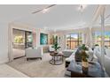 Inviting living room featuring stylish furnishings, artwork, and a sliding glass door to the balcony at 5132 N 31St Way # 144, Phoenix, AZ 85016