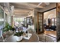 Inviting screened-in porch living space with wood ceiling, tile floor, and a view through open doors at 6221 E Vista Dr, Paradise Valley, AZ 85253