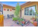 Private courtyard featuring desert plants, seating, and artistic details for outdoor enjoyment at 9517 W Cedar Hill Cir # N, Sun City, AZ 85351