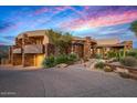 Stunning home featuring unique architecture, desert landscaping, and circular driveway at 9962 E Groundcherry Ln, Scottsdale, AZ 85262