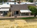 Aerial view showing the private walled-in backyard with a covered patio of the home at 10236 E Minnesota Ave, Sun Lakes, AZ 85248