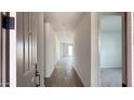 Hallway featuring neutral paint and a tile floor at 15760 W Beryl Ave, Waddell, AZ 85355