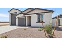 Inviting single-Gathering home featuring a three-car garage and low-maintenance landscaping at 15765 W Cheryl Dr, Waddell, AZ 85355
