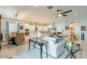 Spacious open-concept living room and kitchen area, perfect for entertaining and gatherings at 15843 S 177Th Ave, Goodyear, AZ 85338