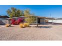 Landscaped single story home featuring mature plants and covered parking at 1660 W 7Th Pl, Mesa, AZ 85201