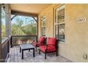 Inviting front porch with comfortable seating, offering a relaxing outdoor space with a view of the neighborhood at 17893 N 93Rd St, Scottsdale, AZ 85255