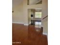 A spacious living room with hardwood floors and natural light coming through the window at 361 E Pinto Ct, Gilbert, AZ 85296