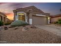 Charming home with a well-maintained desert landscape and an attached two-car garage at 4252 E Desert Sky Ct, Cave Creek, AZ 85331