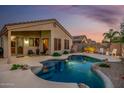 Inviting backyard pool and patio area, perfect for relaxing and entertaining on warm evenings at 4252 E Desert Sky Ct, Cave Creek, AZ 85331