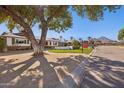 Inviting home on a tree-lined street with well-maintained landscaping at 7313 E Bonita Dr, Scottsdale, AZ 85250