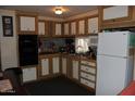 Bright kitchen with light wood cabinets, modern appliances, and ample counter space at 7807 E Main St # F-30, Mesa, AZ 85207