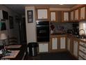 Functional kitchen design with natural lighting and dark countertops at 7807 E Main St # F-30, Mesa, AZ 85207