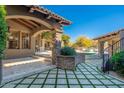 Expansive backyard featuring manicured landscaping, a covered patio, and a pool and spa at 9290 E Thompson Peak Pkwy # 470, Scottsdale, AZ 85255