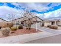 Beautiful home featuring desert landscaping, a two-car garage, and a welcoming entrance at 9520 W Trumbull Rd, Tolleson, AZ 85353