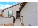Inviting walkway leading to the front door of a well-maintained stucco house at 9520 W Trumbull Rd, Tolleson, AZ 85353
