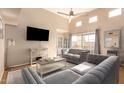 Bright living room features vaulted ceilings, modern furnishings, and large windows with natural light at 11333 N 92Nd St # 2028, Scottsdale, AZ 85260