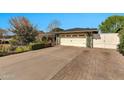 Residential exterior featuring a charming home with a paved driveway and well-maintained landscaping at 1134 E Magdalena Dr, Tempe, AZ 85283