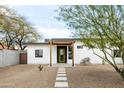 Charming single-story home with desert landscaping and a green front door at 14025 N 11Th Pl, Phoenix, AZ 85022