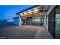 Open patio area with covered space, ceiling fan, and sliding glass doors leading inside the home at 14025 N 11Th Pl, Phoenix, AZ 85022