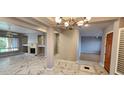 Open living area features marble floors, fireplace, neutral paint, and views to outside space at 1544 N Rico Cir, Mesa, AZ 85213