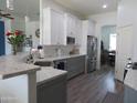 Beautiful kitchen showcasing stainless steel appliances, granite countertops, and modern cabinetry at 15802 N 50Th Dr, Glendale, AZ 85306