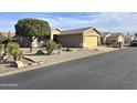 Picture of a quiet neighborhood street shows homes with desert landscaping and attached garages at 2101 S Meridian Rd # 354, Apache Junction, AZ 85120