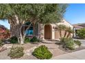Charming home featuring a well-manicured front yard and covered entrance at 26880 W Sierra Pinta Dr, Buckeye, AZ 85396