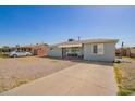 Well-maintained home featuring a spacious driveway and gravel landscaping at 2915 W Montecito Ave, Phoenix, AZ 85017