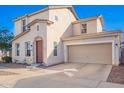 Charming two-story home featuring a two-car garage and well-maintained front yard at 5145 W Odeum Ln, Phoenix, AZ 85043