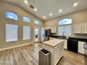 Bright kitchen with stainless steel appliances and butcher block island at 723 E Whitten St, Chandler, AZ 85225