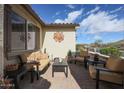 Inviting outdoor patio featuring comfortable furniture, lush plants, and serene views at 16712 S 175Th Ln, Goodyear, AZ 85338