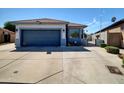 Well-kept home featuring a low maintenance front yard and a two-car garage at 5255 W Cochise Dr, Glendale, AZ 85302