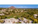 Stunning aerial view showcasing the golf course, community, and Camelback Mountain in the background at 6229 N 30Th Way, Phoenix, AZ 85016