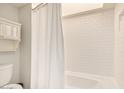 Clean bathroom featuring white subway tiles, a shower with tub, and new fixtures at 6229 N 30Th Way, Phoenix, AZ 85016