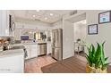 Bright, open kitchen with stainless steel appliances and a spacious dining area nearby at 6229 N 30Th Way, Phoenix, AZ 85016