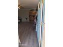 Welcoming entryway with wood-look floors, leading into the cozy living spaces and kitchen at 1116 E 11Th E St, Casa Grande, AZ 85122
